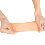 Stretching a silicone gel heel sock to show how far it gives